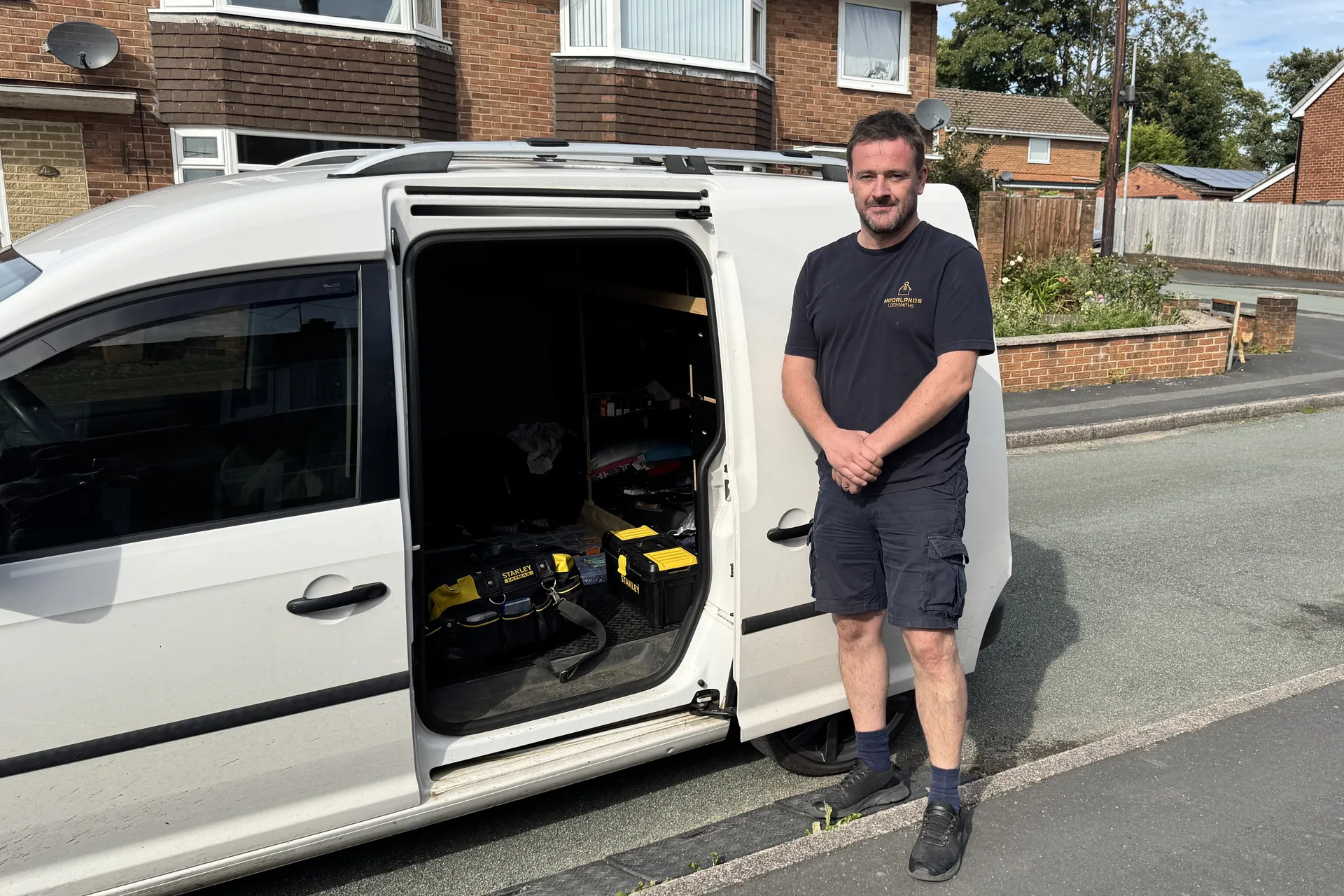 Brett Garner standing beside his van in Forsbrook